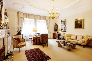 First-floor drawing room transformed into a consulting space, maintaining its historic charm with contemporary touches.